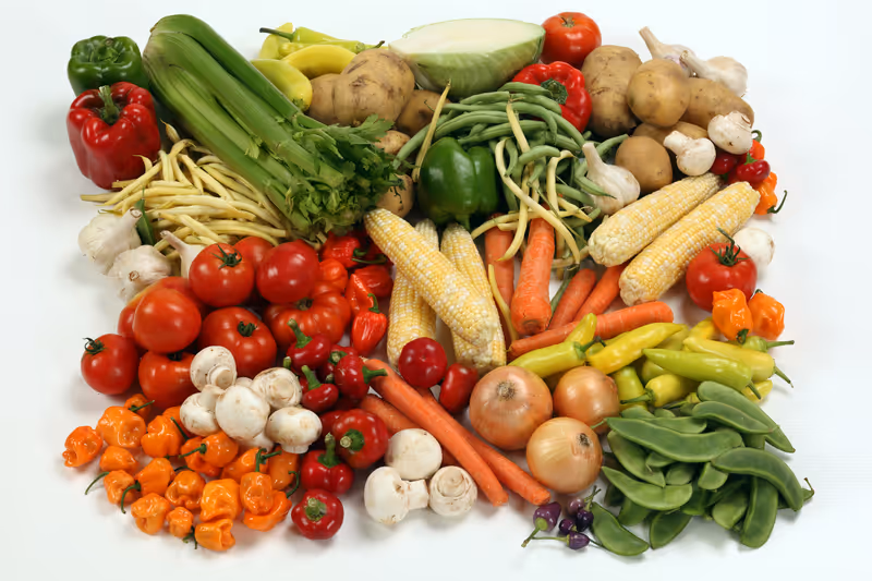 Fresh, dog-safe vegetables arranged on a cutting board